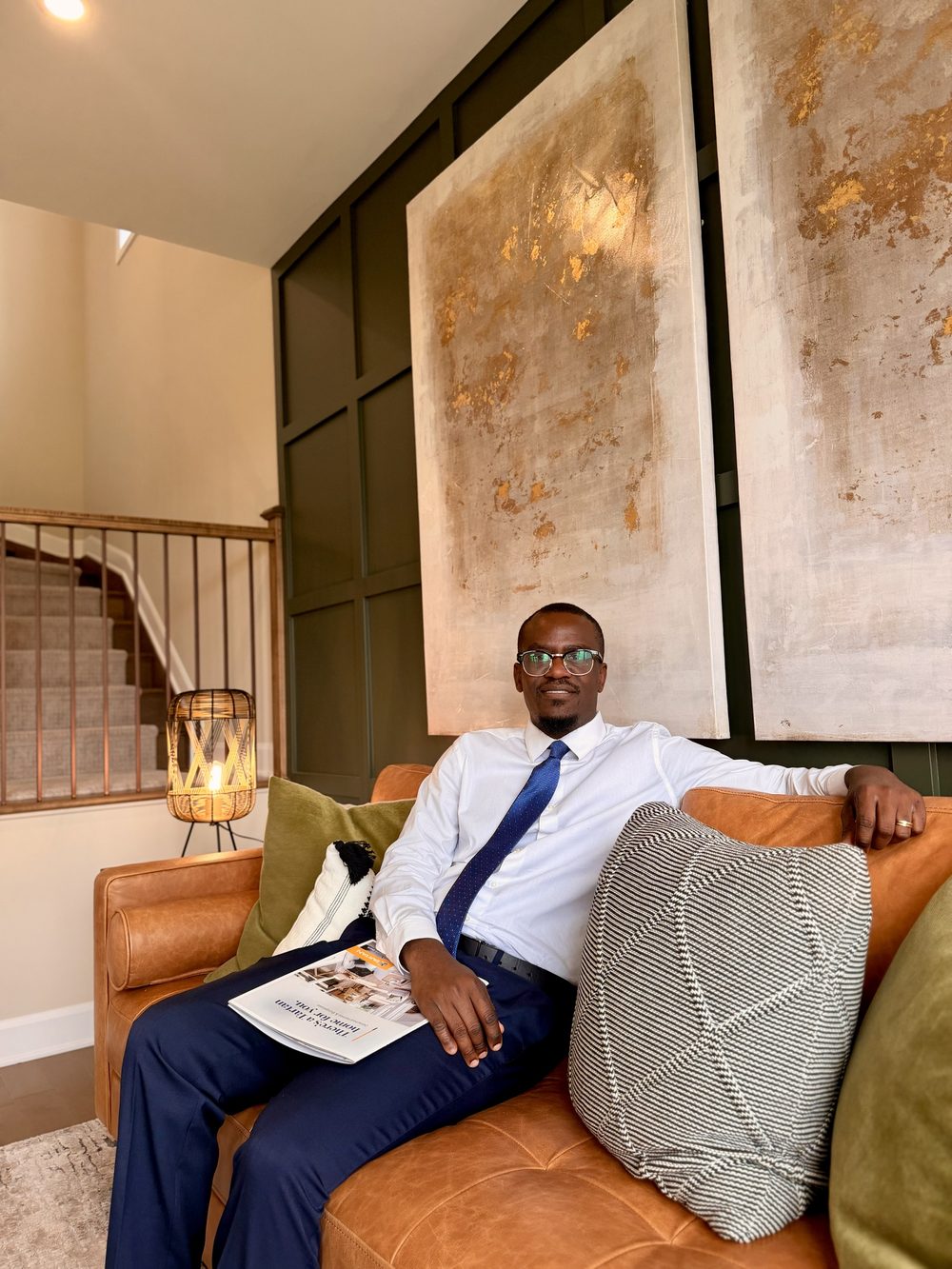 Jean seated in a show home living room